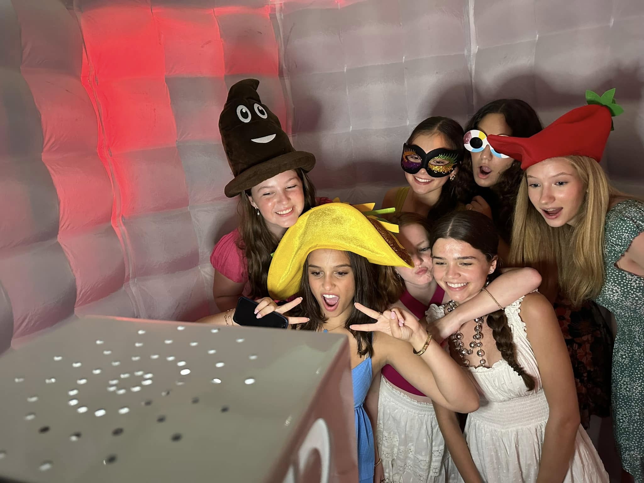 Guests having fun inside John's enclosed photo booth